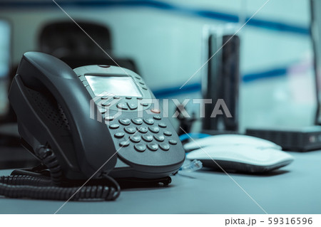 Closeup iphone on the wood floor,IP Phones for business communication between organizations Closeup iphone on the wood floor,IP Phones for business communication between organizations 59316596