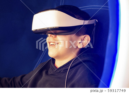 Child playing game with VR glasses. Technology, 59317749