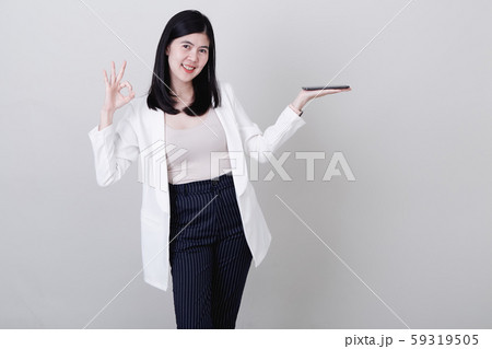 Businesswoman pointing her finger on white Businesswoman pointing her finger on white 59319505