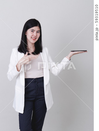Businesswoman pointing her finger on white Businesswoman pointing her finger on white 59319510