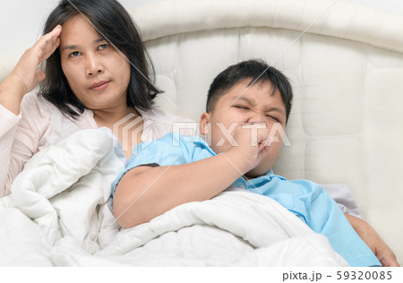Mother has a headache because her son is sick and 59320085