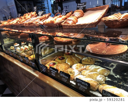 Variety of high-calorie delicious desserts lying on the bakery window 59320281