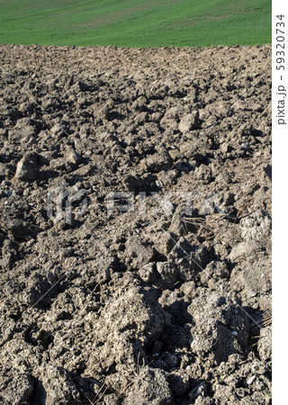 Ploughed soil close up. Sunny day. Ploughed soil close up. Sunny day. 59320734