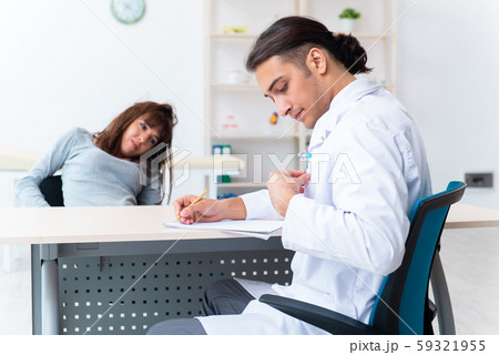 Mentally ill woman patient during doctor visit Mentally ill woman patient during doctor visit 59321955