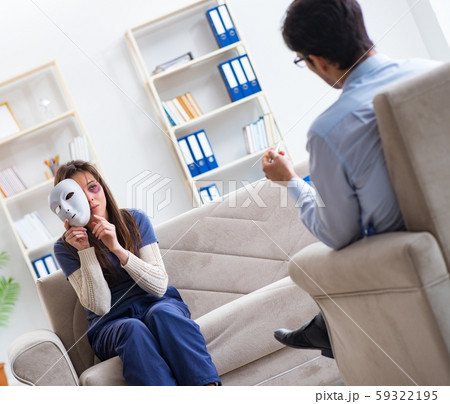 Woman suffering from home violence visiting doctor 59322195