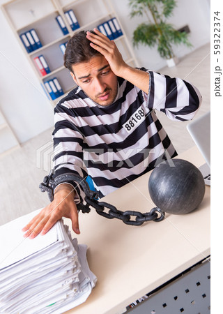 Young employee feeling like prisoner at work 59322374
