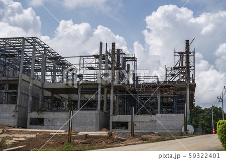 Building and Construction Site in progress. Building construction site against cloudy sky. Metal 59322401