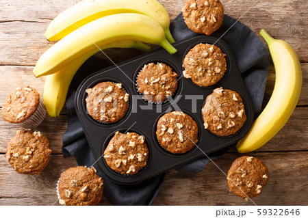 Freshly baked banana walnuts muffins close-up in a 59322646