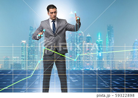 Businessman controlling the market with strings 59322898