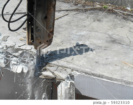 Concrete hacking heavy machine used to crush concrete to small pieces at the construction site in Malaysia. Concrete hacking heavy machine used to crush concrete to small pieces at the construction site in Malaysia. 59323310