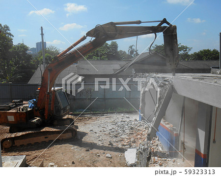 Concrete hacking heavy machine used to crush concrete to small pieces at the construction site in Malaysia. Concrete hacking heavy machine used to crush concrete to small pieces at the construction site in Malaysia. 59323313