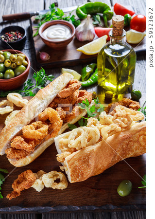 Bocadillos De Calamares on a wooden board Bocadillos De Calamares on a wooden board 59323672