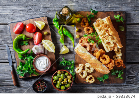 squid sandwiches served on a wooden board squid sandwiches served on a wooden board 59323674