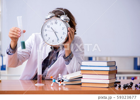 Chemistry lecturer during lecture in college 59323677