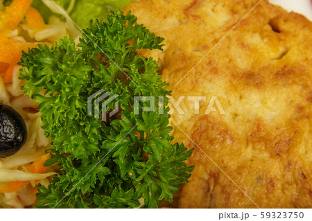Pasta with a piece of grilled meat and salad. Pasta with a piece of grilled meat and salad. 59323750