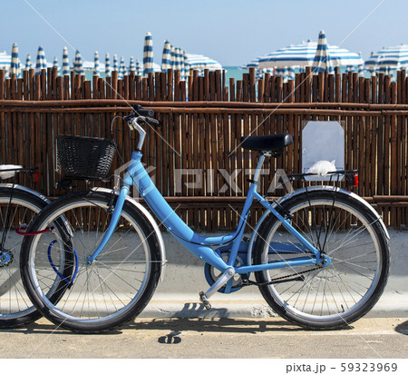 Rental bikes on the beach. Blue bicycles on the Rental bikes on the beach. Blue bicycles on the 59323969