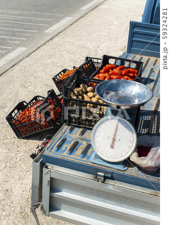 Small italian apo truck with tomatoes. Farmer sale 59324281