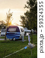 Caravans and campers on green meadow in campsite. 59324355