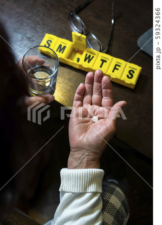 Senior woman take pills from box. Healthcare and 59324366