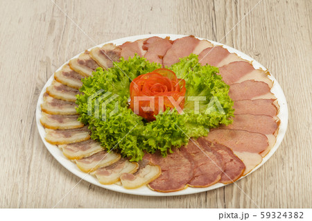 Sausage cuts of different varieties on a plate. Sausage cuts of different varieties on a plate. 59324382