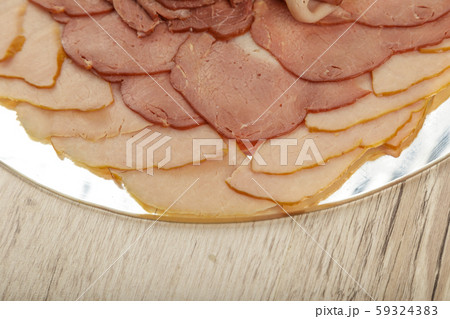 Sausage cuts of different varieties on a plate. Sausage cuts of different varieties on a plate. 59324383