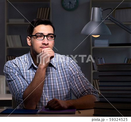 Student preparing for exams late at night 59324525