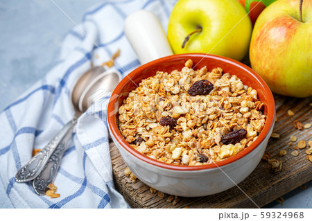 Homemade granola with apples and raisins. Homemade granola with apples and raisins. 59324968