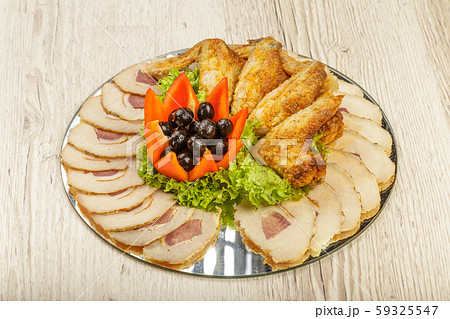 Dish from tartlets chicken wings and meat sliced 59325547