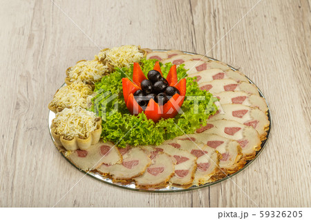 Meat sliced on a mirror dish decorated with Meat sliced on a mirror dish decorated with 59326205