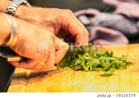 The chef in the kitchen prepares food The chef in the kitchen prepares food 59326379