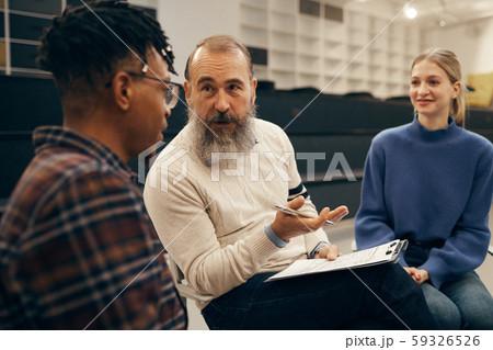 Senior man talking to the people Senior man talking to the people 59326526