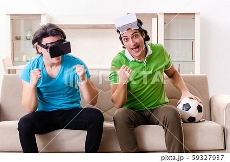 Friends watching football at home Friends watching football at home 59327937