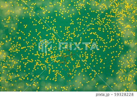 Green background with glitter gold stars 59328228