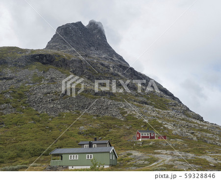 green and red wooden mountain huts cabin at massif 59328846