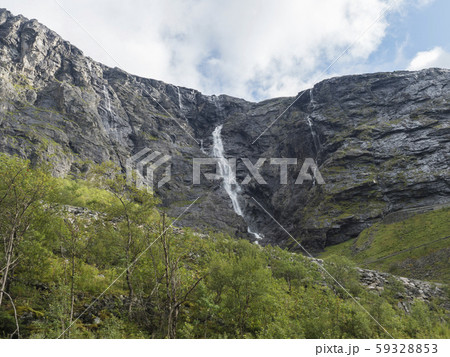 Tall waterfall at Romsdalen valley with rocks and 59328853