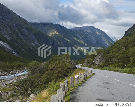 Winding road with mountain massif Trolltindene, 59328854