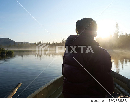 Fisherman man in rowing boat at lake Fisherman man in rowing boat at lake 59328888