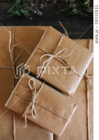 Presents wrapped in brown paper and string 59332631