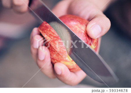 Hand holding and chopped apple fruit 59334678