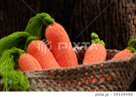 knitted carrot with green leaf in basket, handmade product for home ornaments knitted carrot with green leaf in basket, handmade product for home ornaments 59339499
