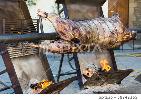 Whole bull carcass on spit Whole bull carcass on spit 59343365