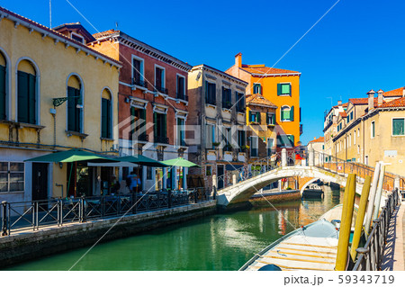 View of canals and cityscape with colorful buildings in Venice 59343719