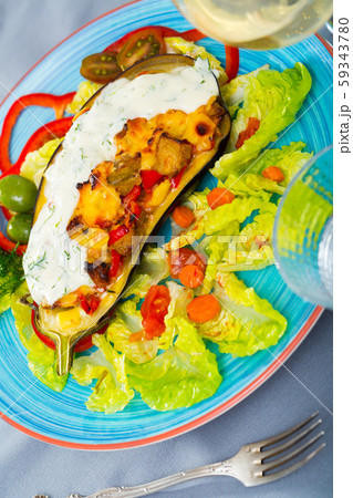 Stuffed eggplant with vegetables and cheese 59343780
