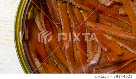 Closeup of tinned anchovy fillets in oil 59344022