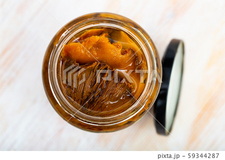 Tasty canned milk mushrooms marinated at glass jar 59344287