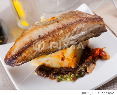 Baked mackerel fillet with potatoes Baked mackerel fillet with potatoes 59344852