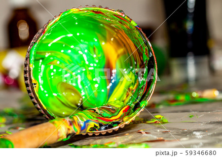 Close up of liquid artist colours on brush and pot 59346680