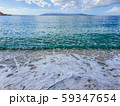 Pebble beach and wave foam 59347654