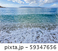 Pebble beach and wave foam 59347656