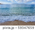 Pebble beach and wave foam 59347659